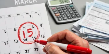 Calendar highlighting FSA grace period deadline with calculator and medical bills